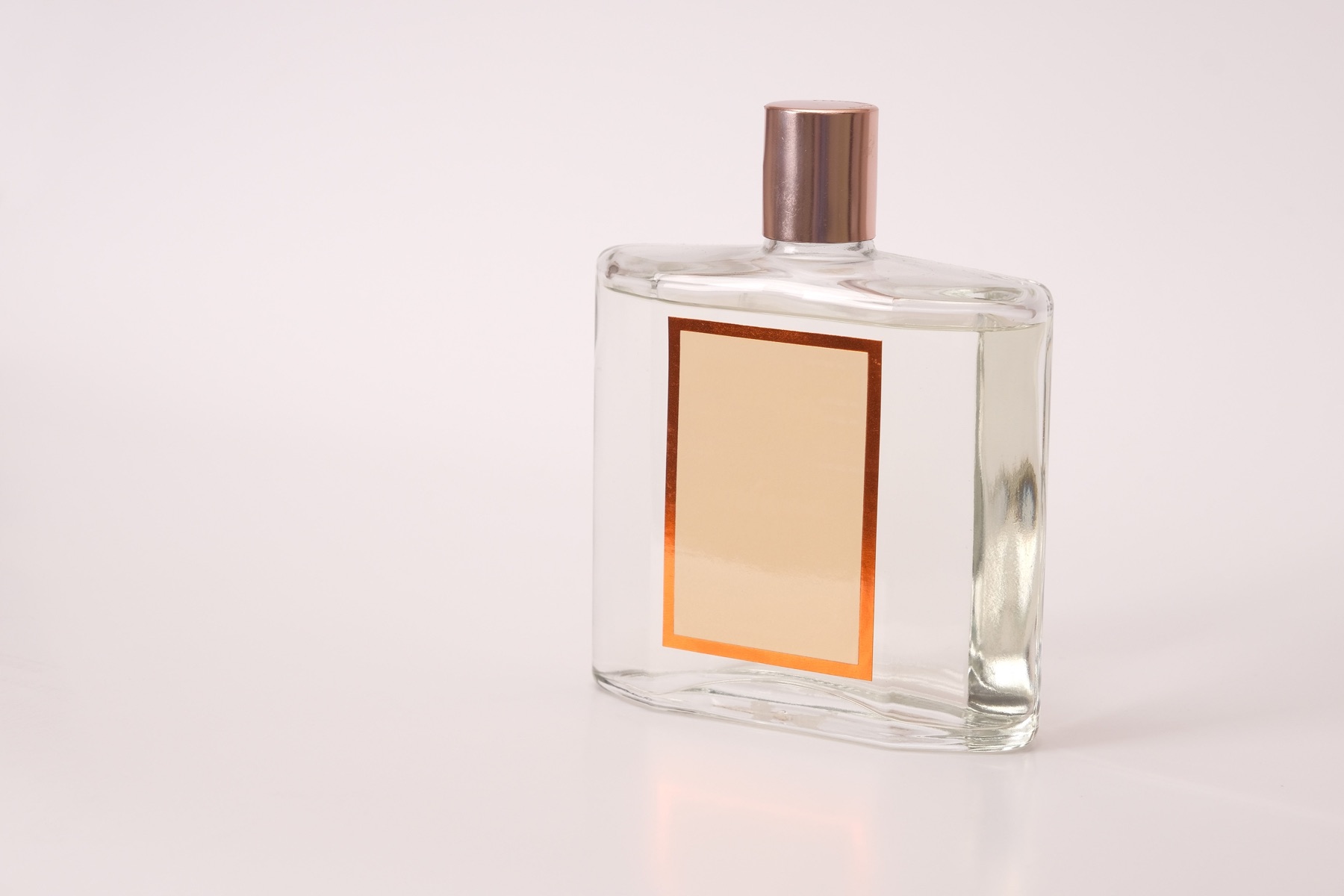 Clean perfume bottle on a light background